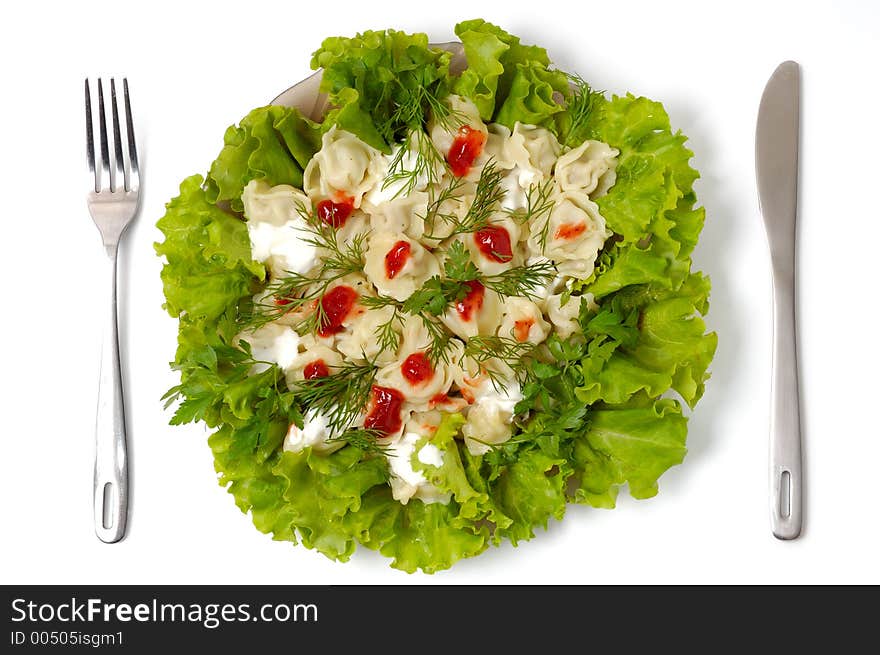 Ravioli With Greens Sour Cream And Ketchup Dish Isolated