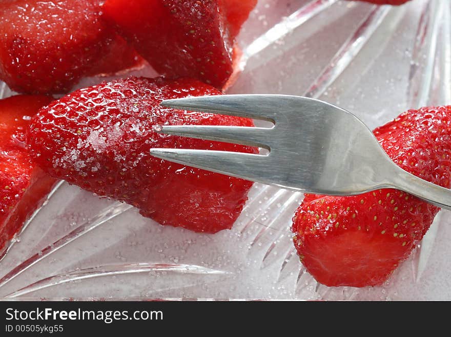 Delicious strawberry and a fork. Delicious strawberry and a fork