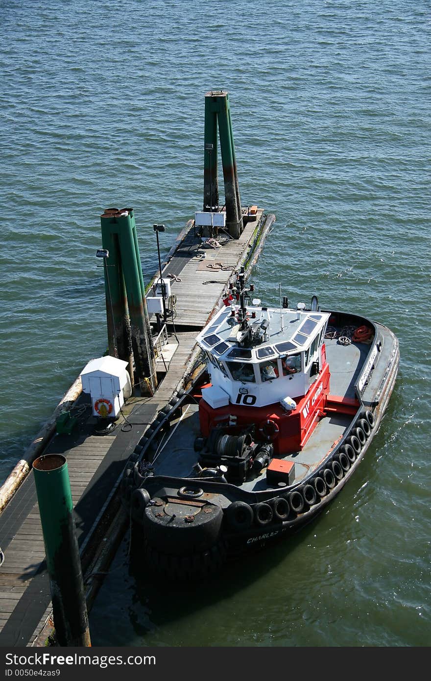 Tug boat docked at marina