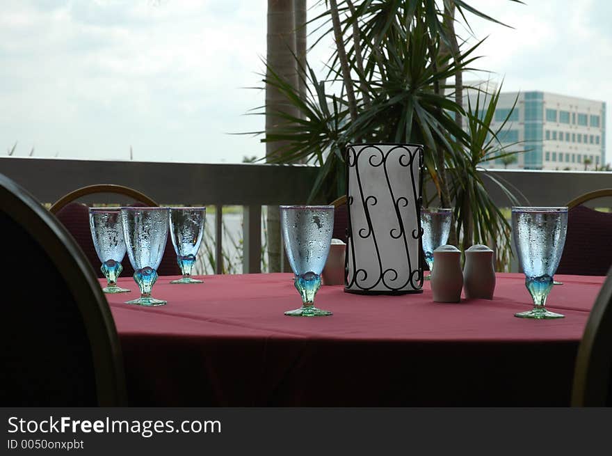 A set table outdoors on a hot day. A set table outdoors on a hot day