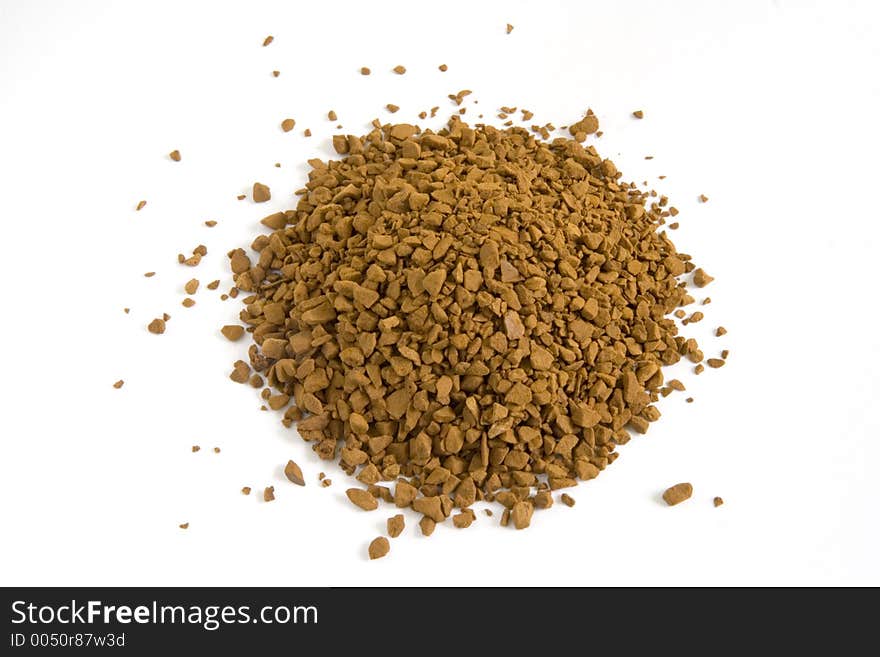 Pile of instant dried coffee grains isolated against white background. Pile of instant dried coffee grains isolated against white background.