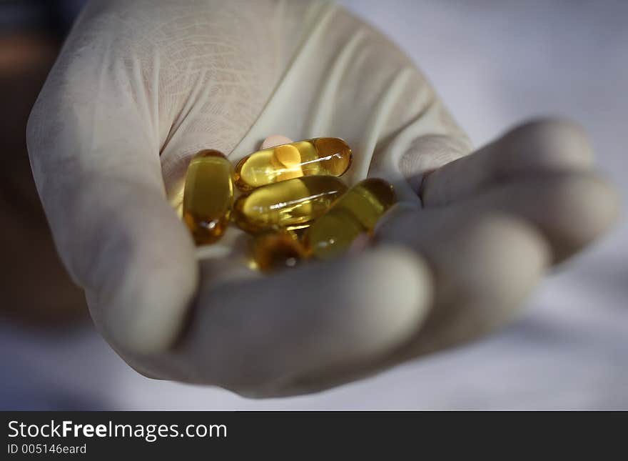 Image of pills in a doctors hand. Image of pills in a doctors hand