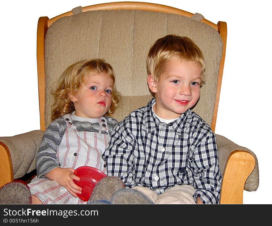 Two kids on a rocking chair. Two kids on a rocking chair