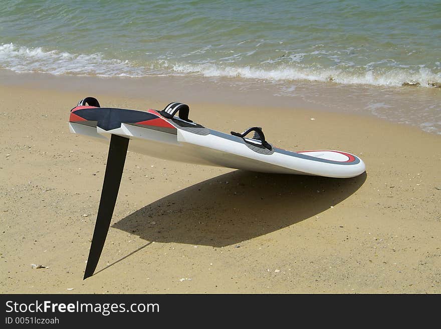 Sailboard On The Beach