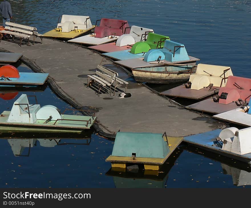 Several small boats waiting for custimers on a sunny sunday afternoon. Several small boats waiting for custimers on a sunny sunday afternoon