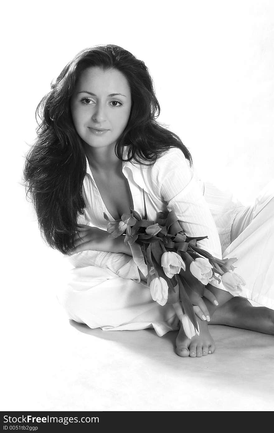 Beautiful woman in white clothes with a bouquet. Beautiful woman in white clothes with a bouquet.