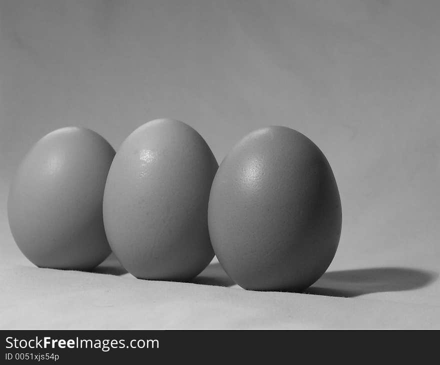 Black and white shot of three eggs. Black and white shot of three eggs.