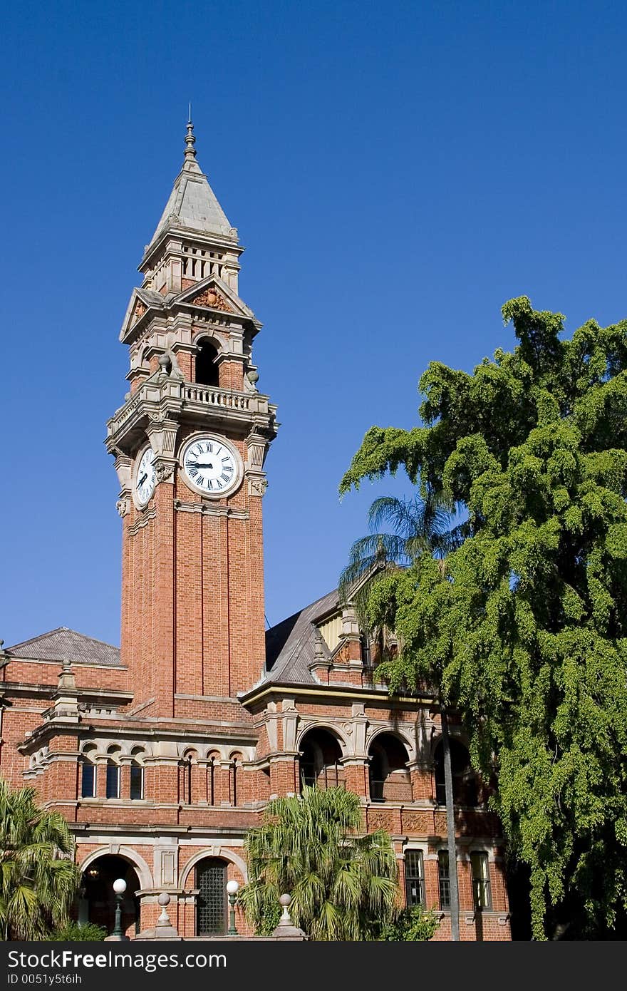 Church clock against blue sky