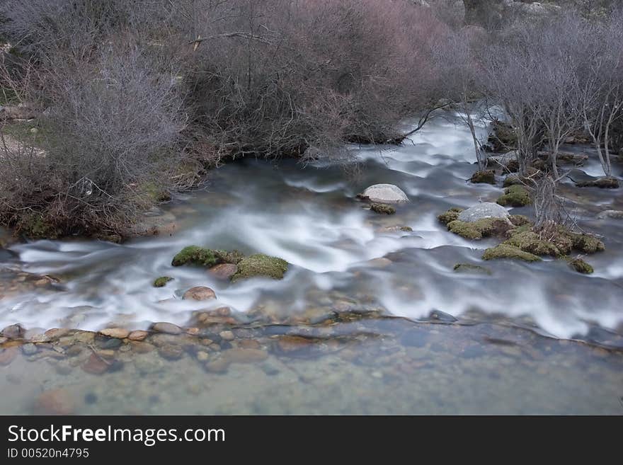 Artistic long exposure of a water in a river. Artistic long exposure of a water in a river