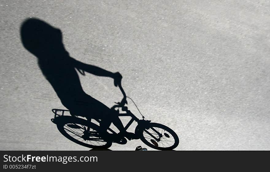 Shade of child on a bike