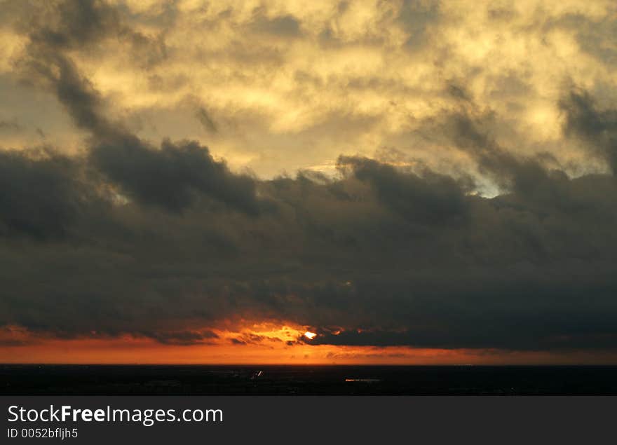 Sun Peeking Behind Clouds