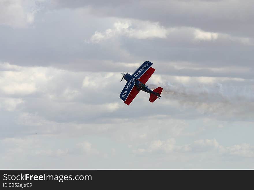 Plane performing midair tricks. Plane performing midair tricks.