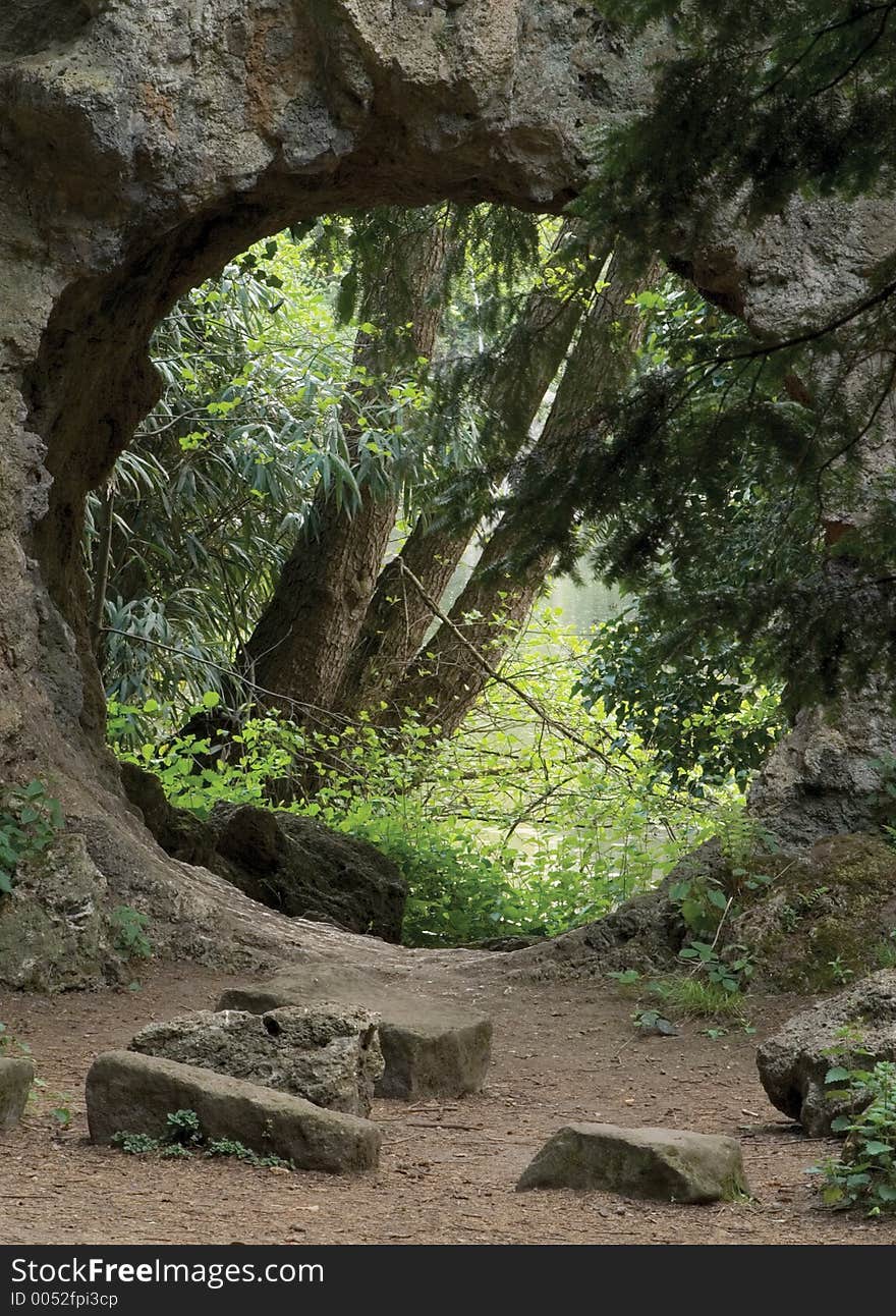 A monument ruin with view through to lake beyond