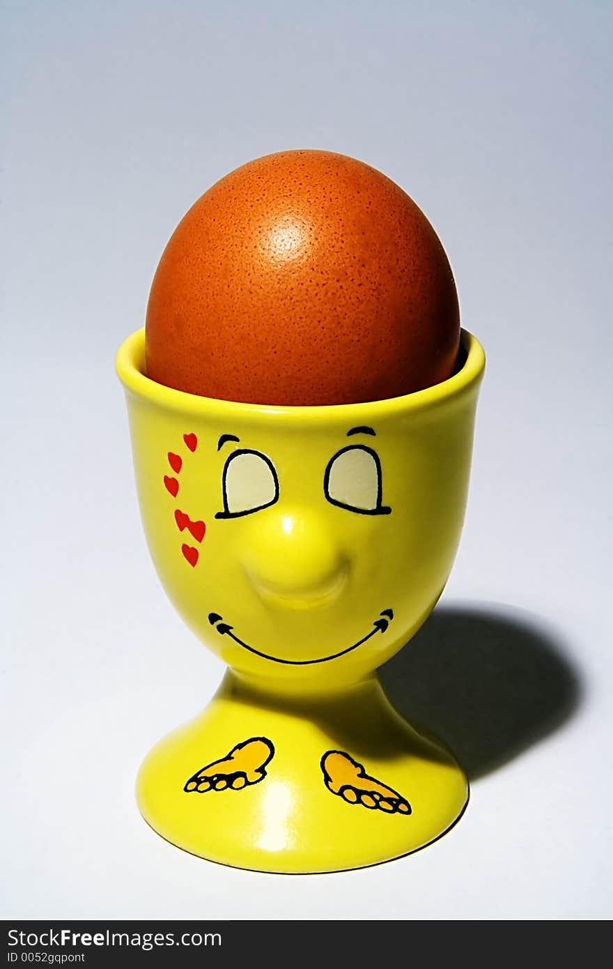 Egg in egg-cup with a smiling muzzle