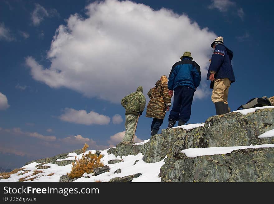 Climbers, mountains and blue sky.