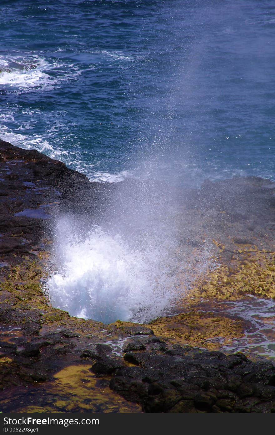 Spouting Horn and Rainbow (Ocean Attraction in Kauai, Hawaii)