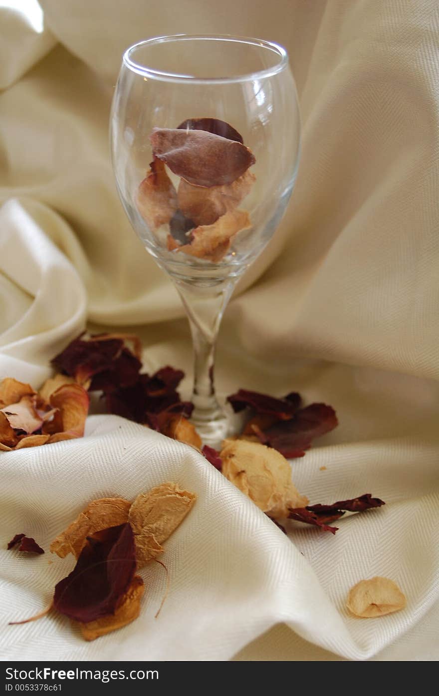 Dried rose petals in a wine glass. Dried rose petals in a wine glass