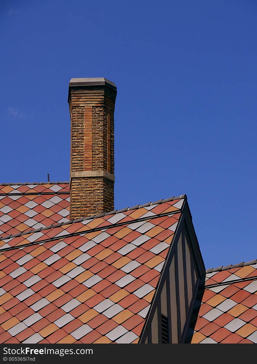 Pink and red tile shingles on a roof