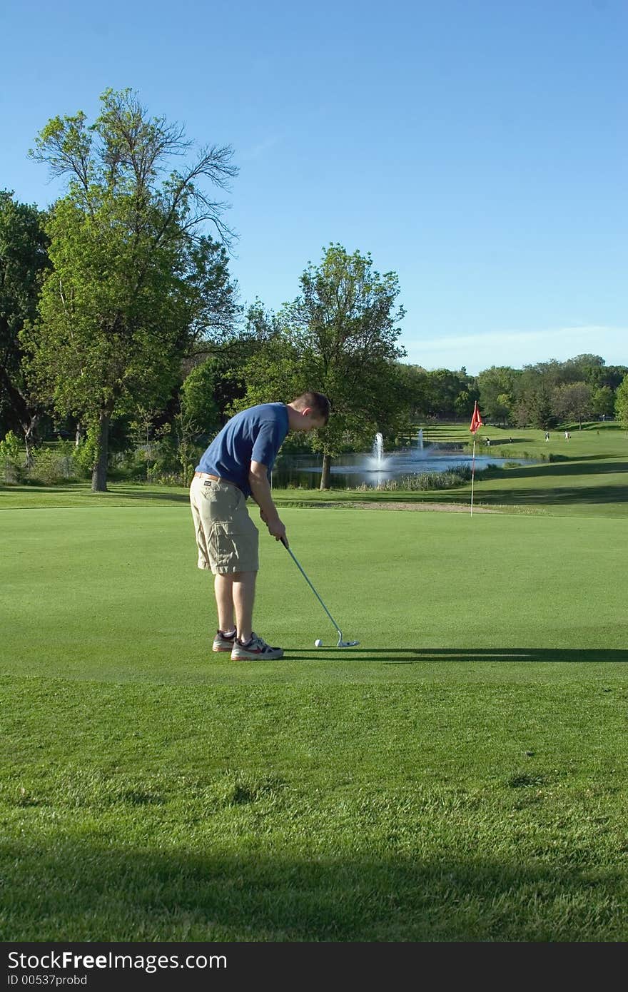 Golfer aiming his shot