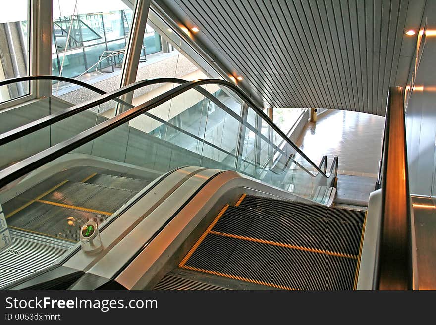 Escalator, next to window