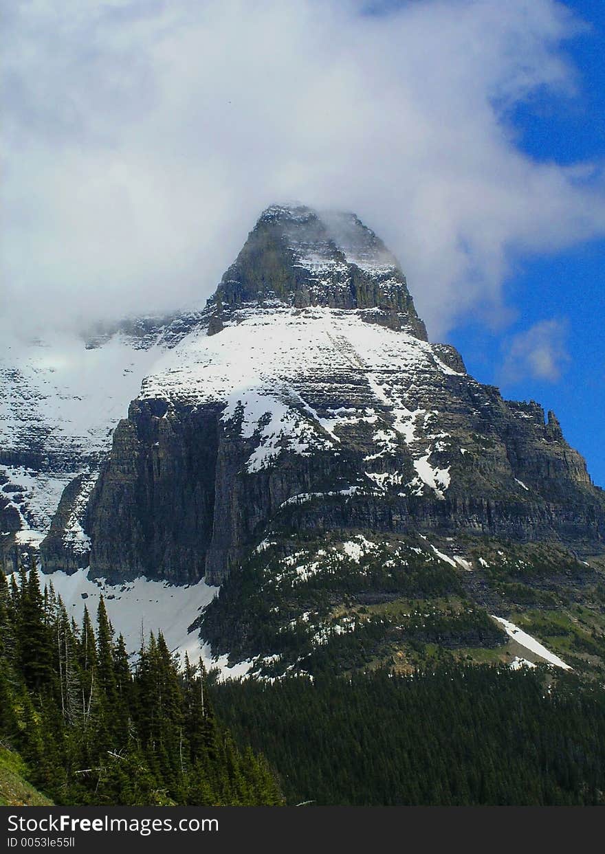 This mountain is one of the most spectacular in Glacier National Park and had some cloud cover on this particular day. This mountain is one of the most spectacular in Glacier National Park and had some cloud cover on this particular day.