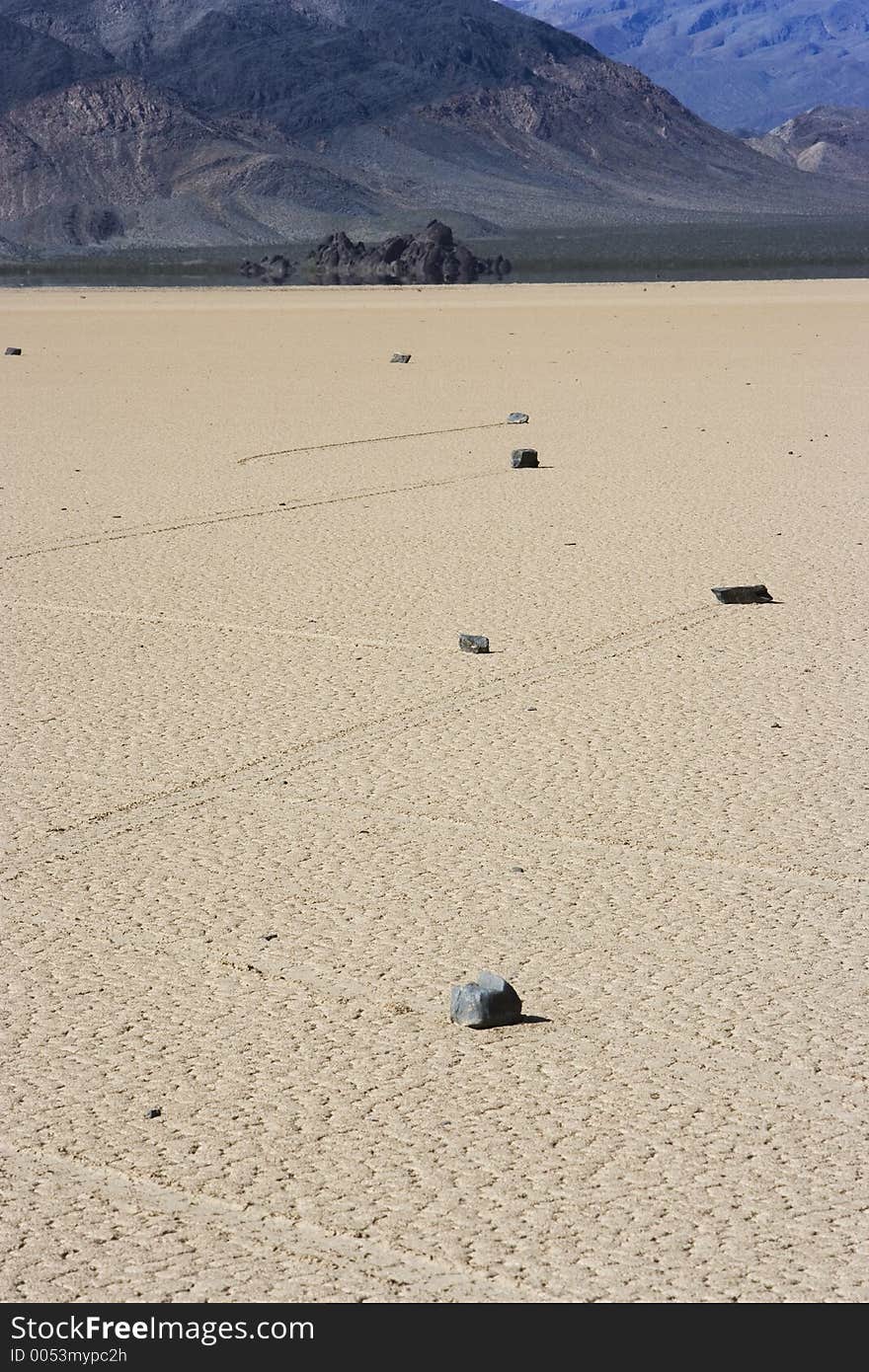 The trails of rocks that mysteriously move across the playa make crisscrossing patterns.  Death Valley, California, USA. The trails of rocks that mysteriously move across the playa make crisscrossing patterns.  Death Valley, California, USA.