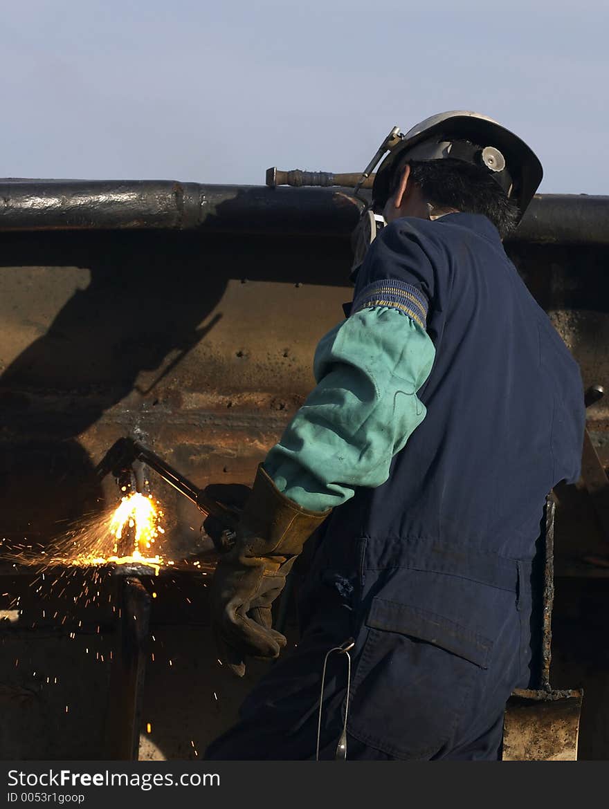 Worker burning steel. Worker burning steel