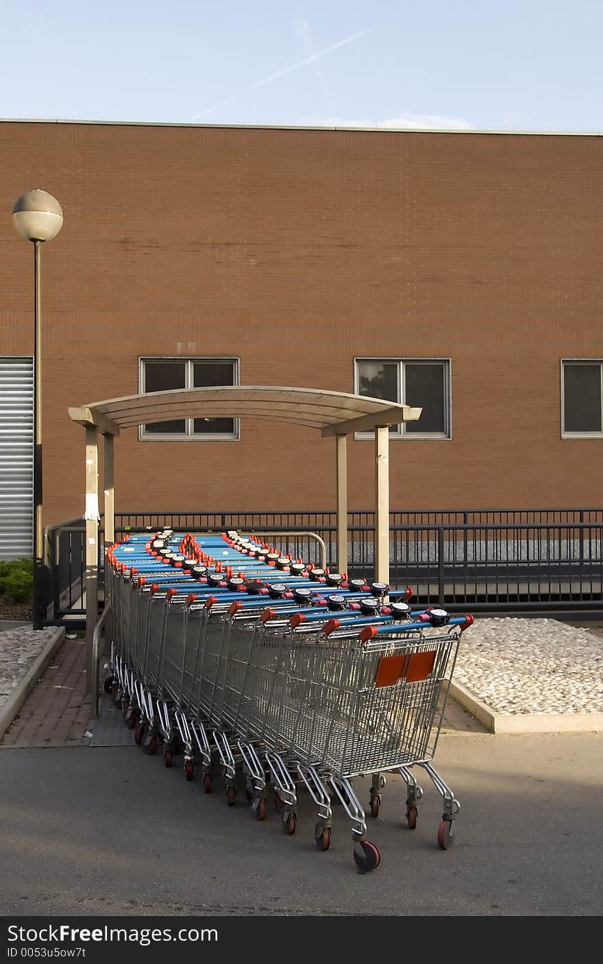 A row of supermarket trolleys. A row of supermarket trolleys