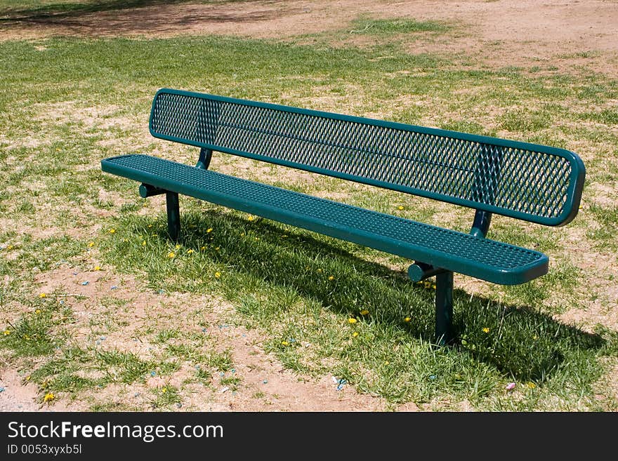 An empty park bench. An empty park bench