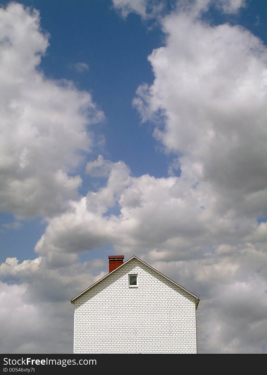 Landscape with the new built house against the blue sky. Landscape with the new built house against the blue sky