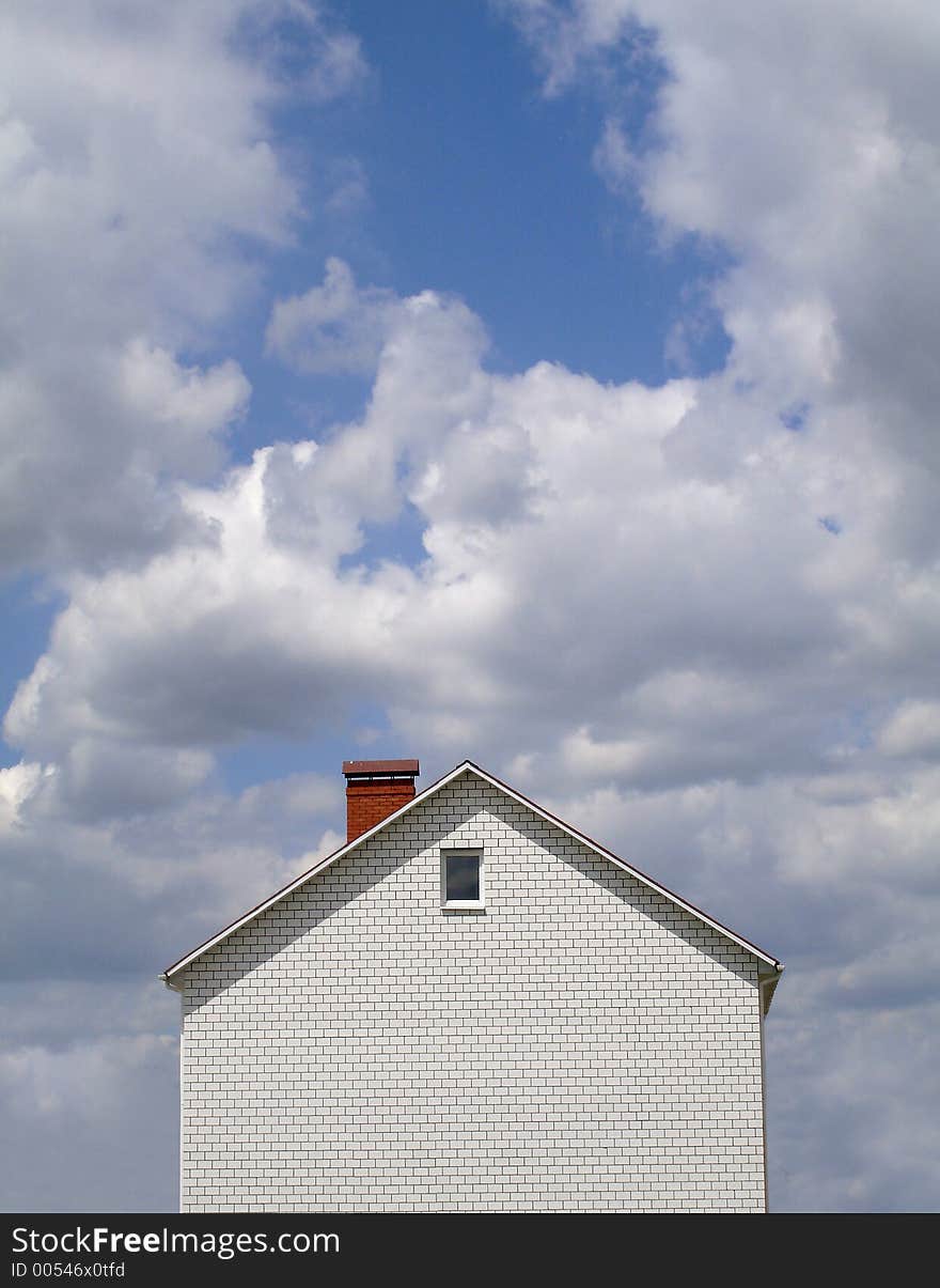 Landscape with the new built house against the blue sky. Landscape with the new built house against the blue sky