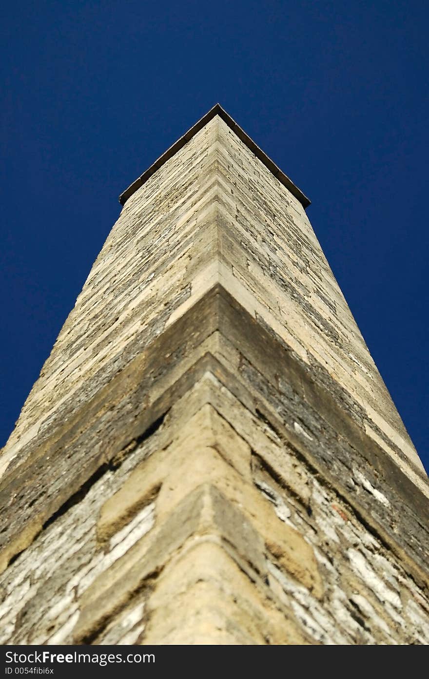 Stone brick factory chimney from British Victorian era. Stone brick factory chimney from British Victorian era