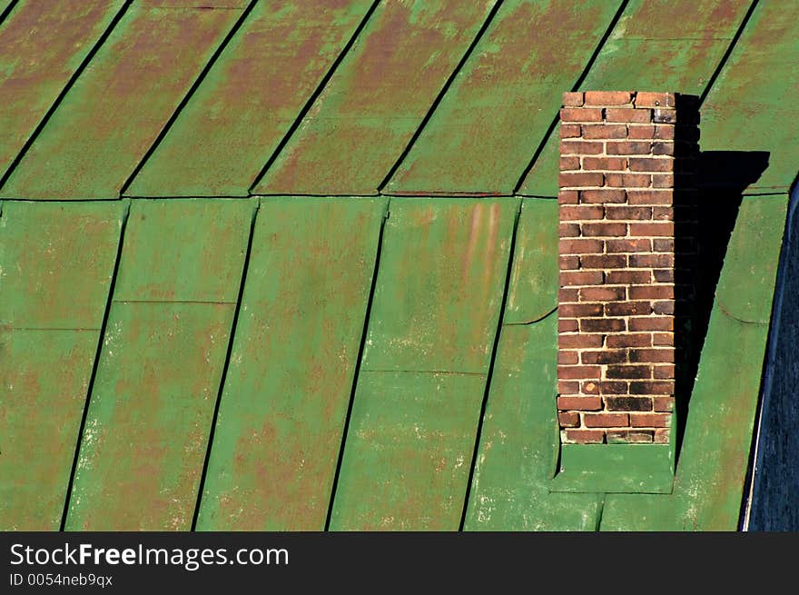 Chimney on green barn roof, horizontal. Abstract.