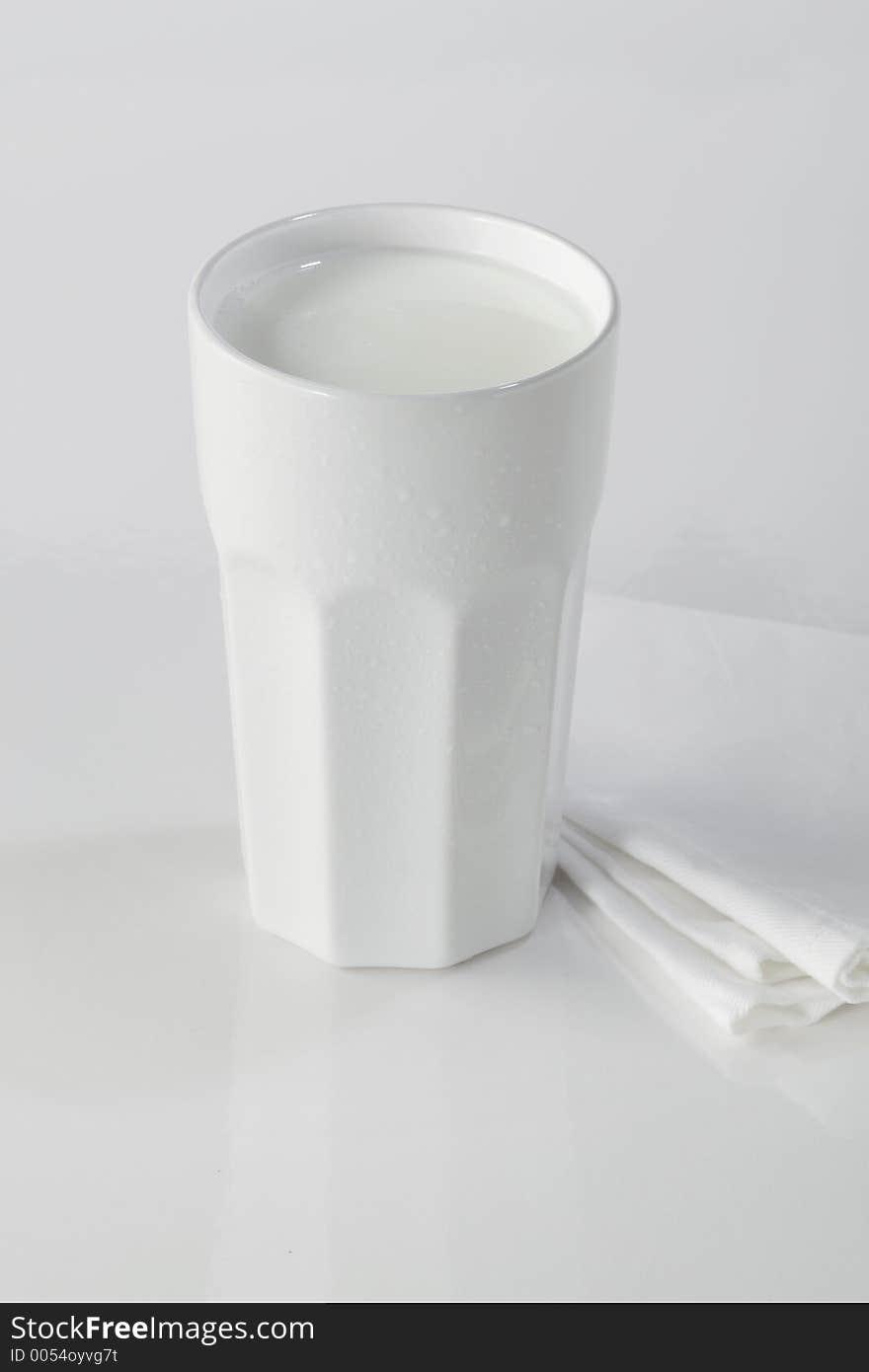 A white drugstore mug with fresh milk. A white drugstore mug with fresh milk