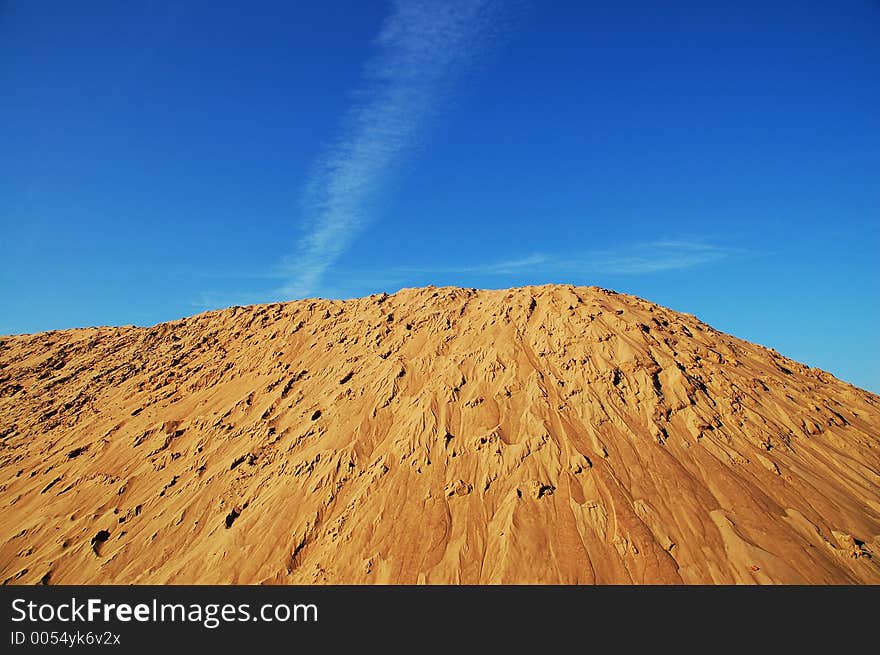 Lake sand on a background of the dark blue sky. Lake sand on a background of the dark blue sky.