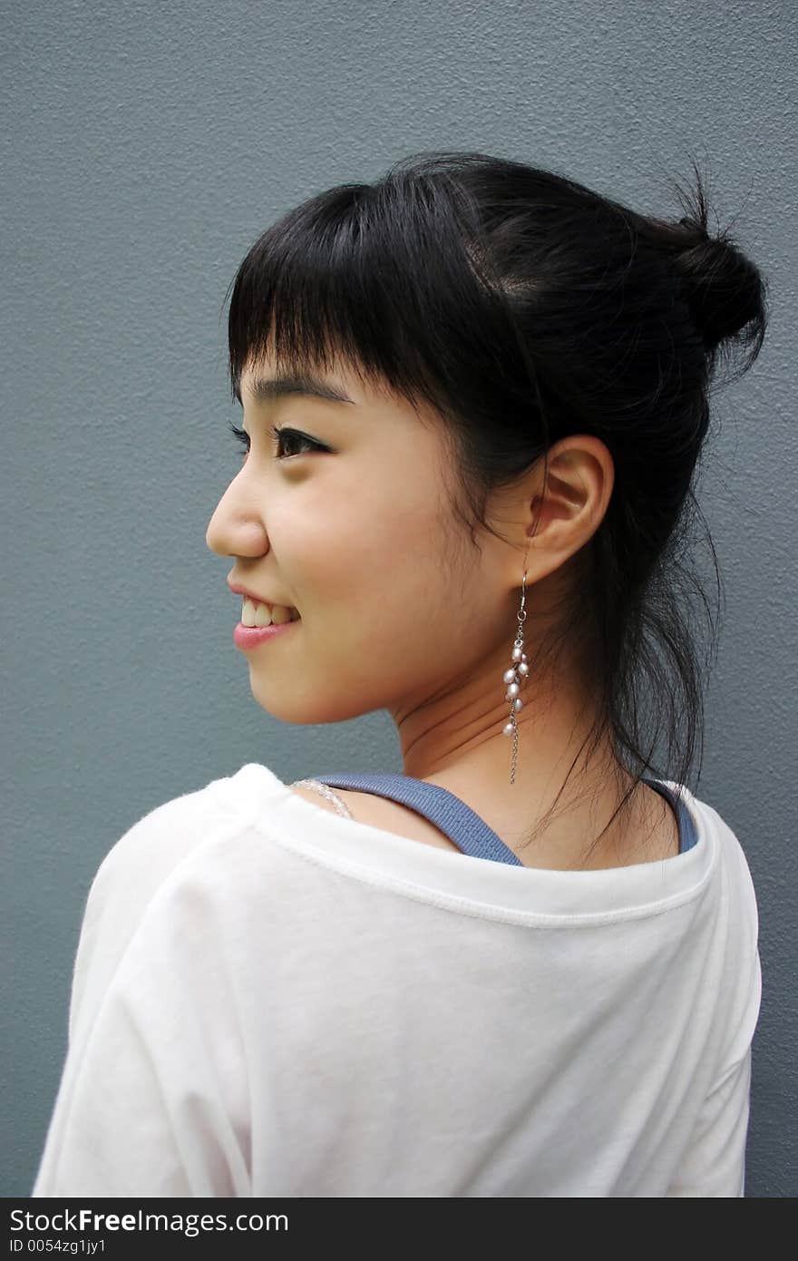 Attractive Young Korean Woman With Her Head Turned