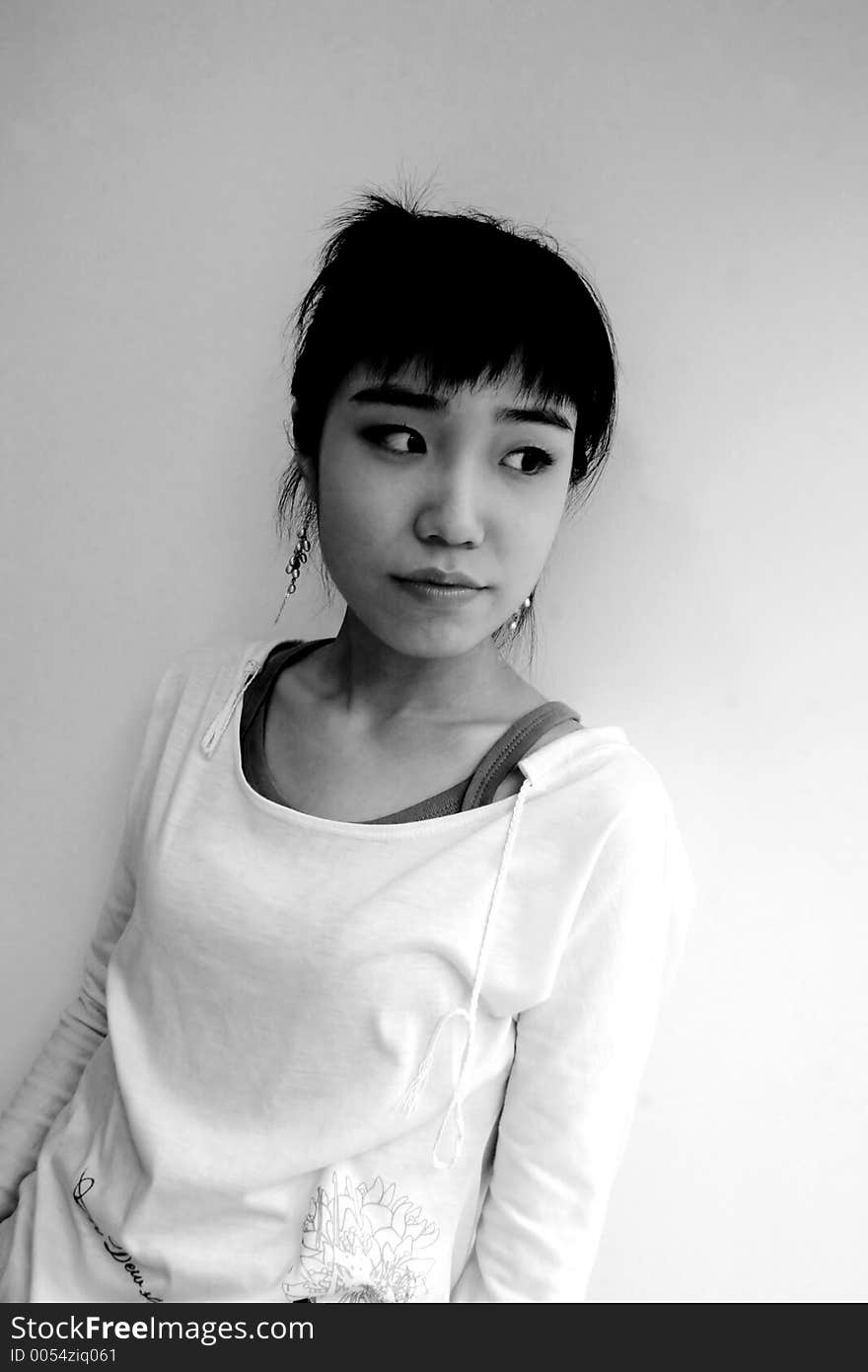 Looking doutbtful - Black and white portraitof an attractive young Korean woman