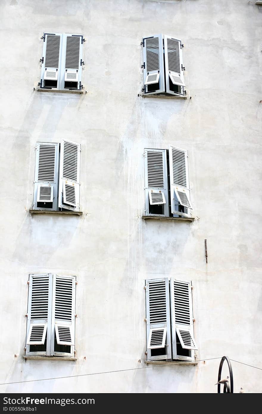 Corsica -France  in the summer: detail of shutter of an old house. Corsica -France  in the summer: detail of shutter of an old house