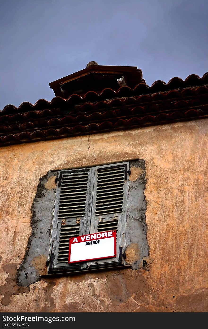 Corsica -France  in the summer: detail of shutter of an old house. Corsica -France  in the summer: detail of shutter of an old house