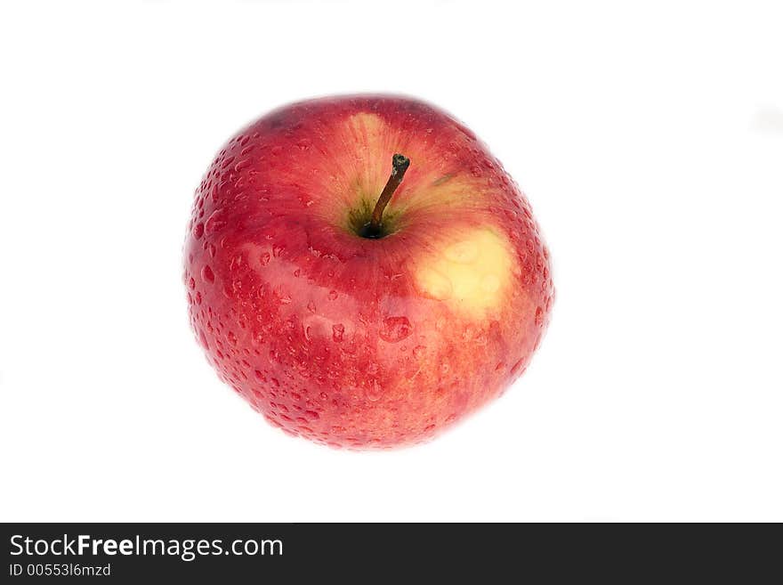 A macro shot of a red apple made withy a 50mm CANON 2.5 lens