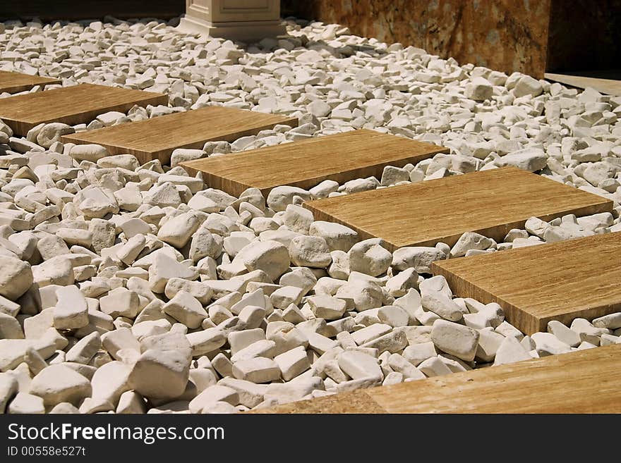 Abstract marble path design with white rocks