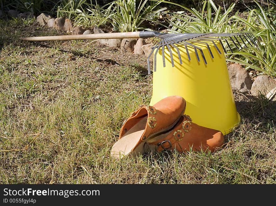 Rake Resting On A Bucket