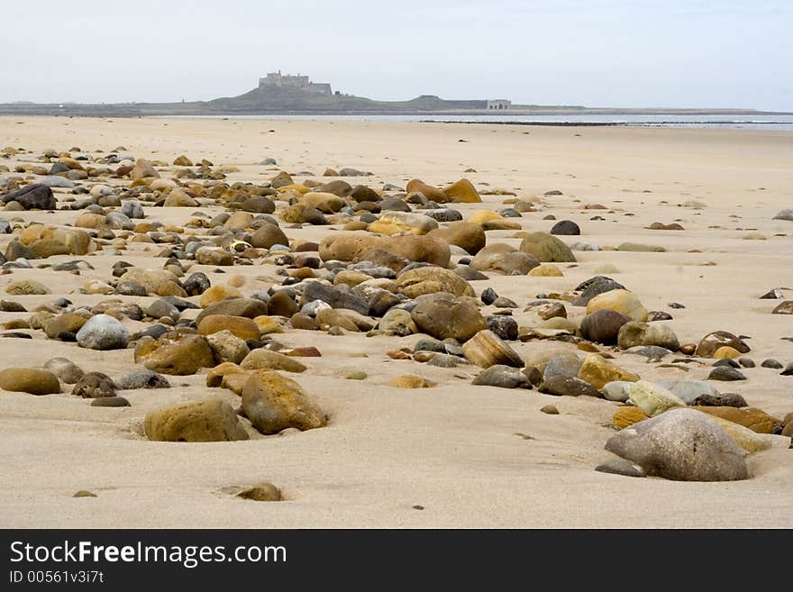 Sand, pebbles and Holy Island