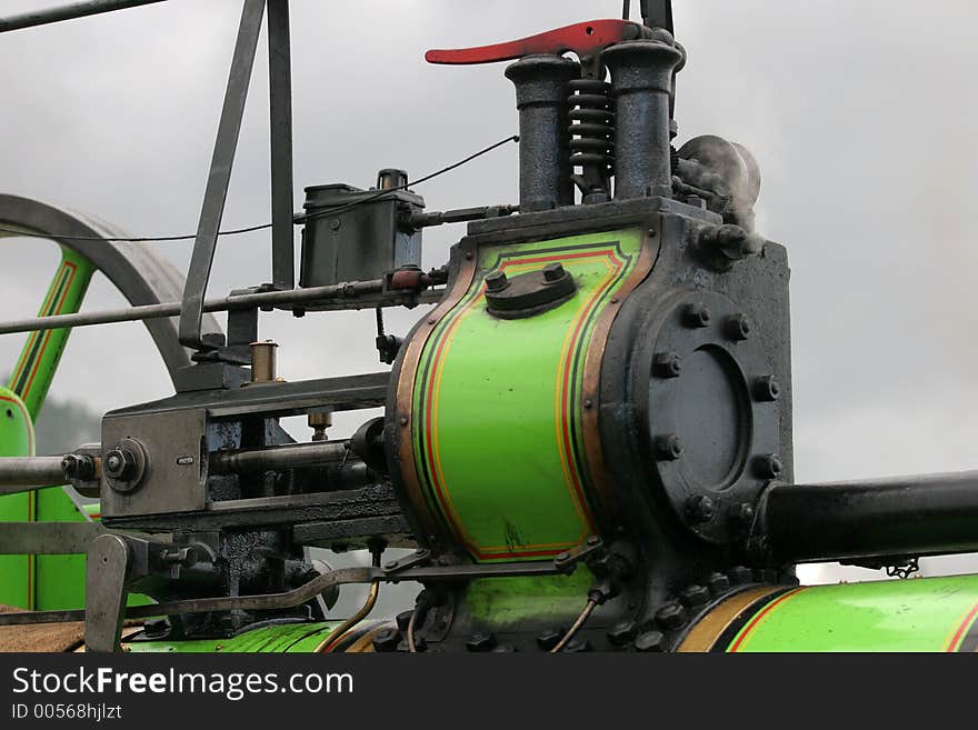 Detail shot of working traction engine showing to of cylinder casing and part of the rod/slid assembly. Detail shot of working traction engine showing to of cylinder casing and part of the rod/slid assembly.