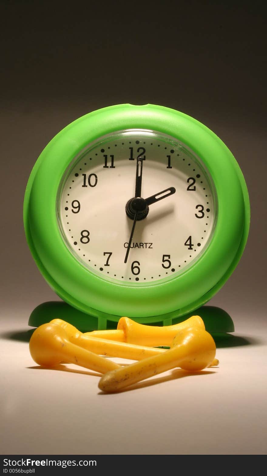 Clock and golf tees. Clock and golf tees