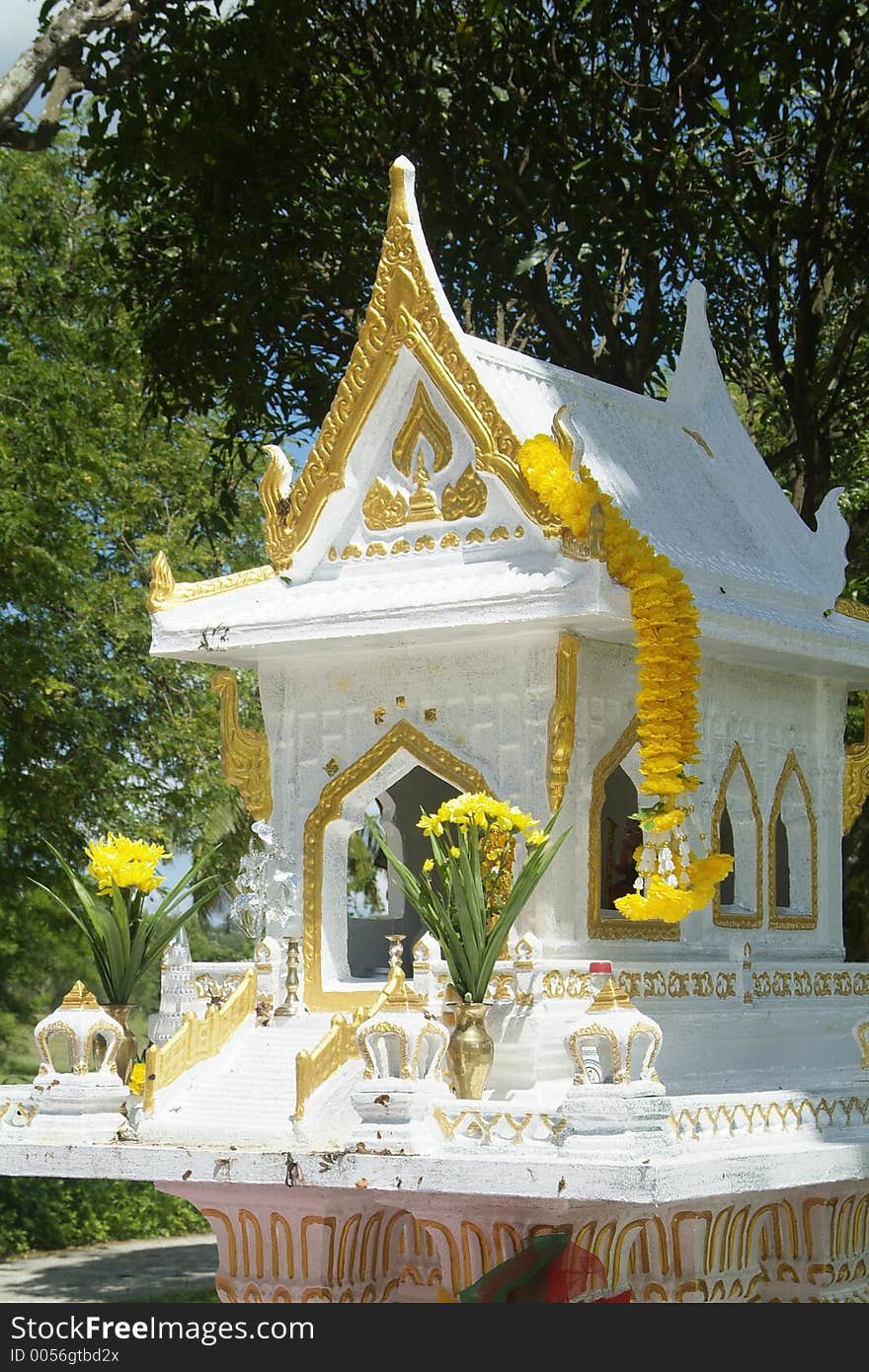 White and gold spirit house in Thailand