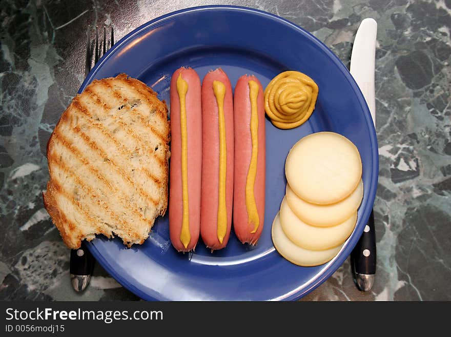 Hot dog with mustard, toast and cheese