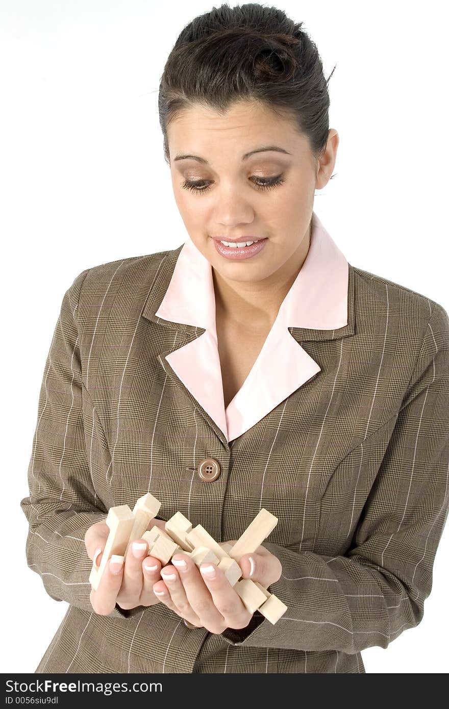 Woman with frustrated expression and hand full of wooden puzzle pieces. Woman with frustrated expression and hand full of wooden puzzle pieces.