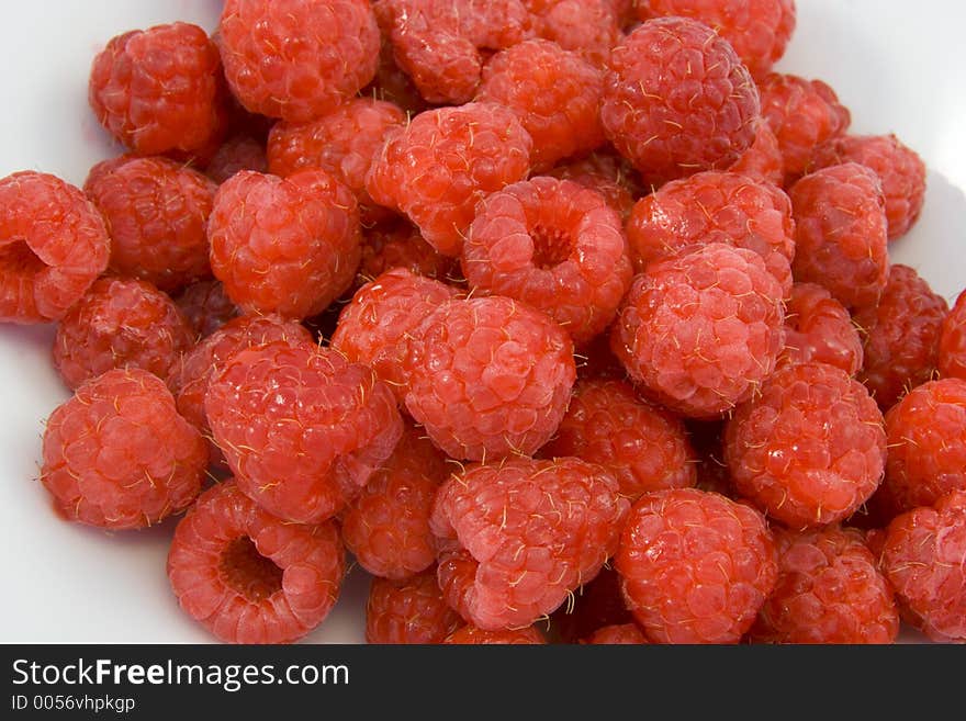 Raspberries in white bowl