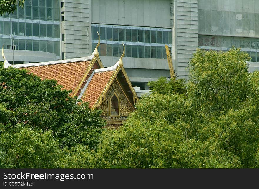 Buddhist temple among trees in Bangkok